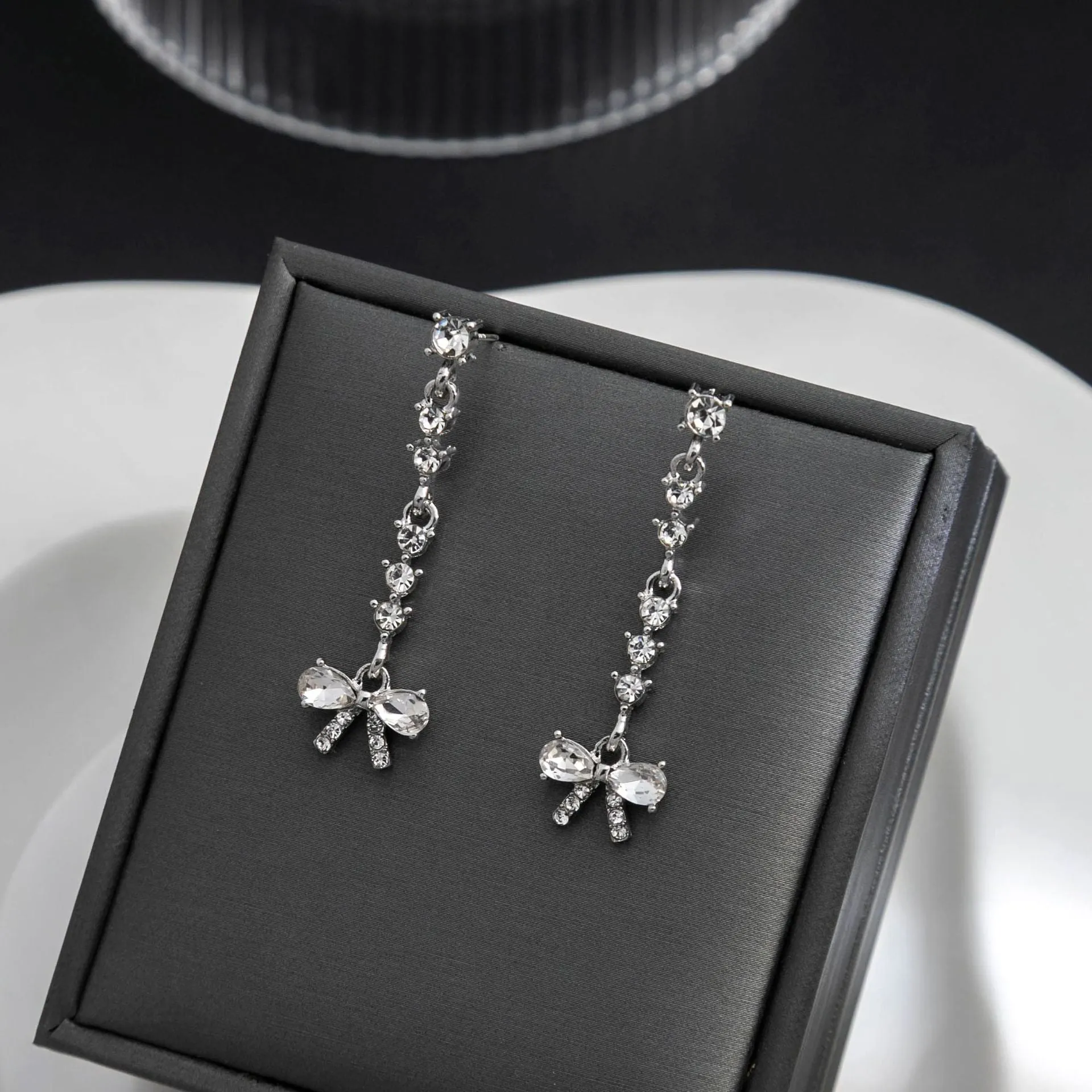Wholesale Bow Studded Diamond Long Tassel Alloy Earrings