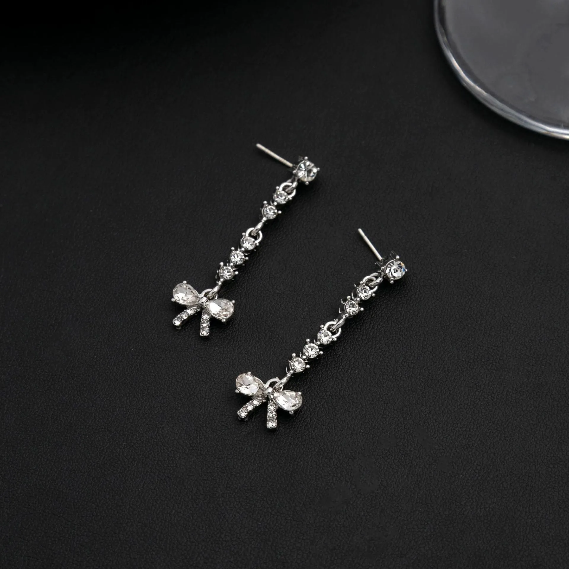 Wholesale Bow Studded Diamond Long Tassel Alloy Earrings