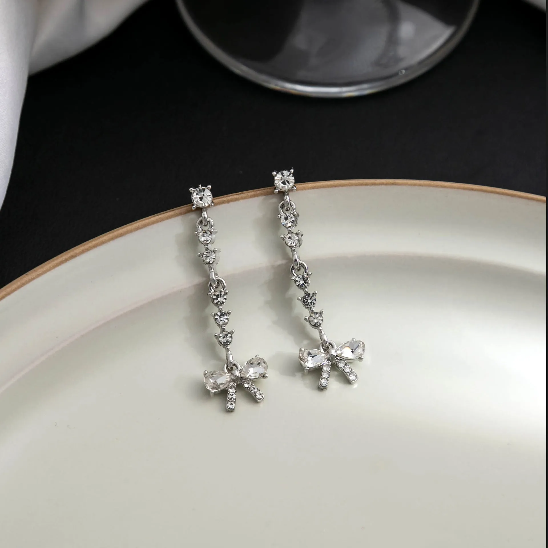 Wholesale Bow Studded Diamond Long Tassel Alloy Earrings