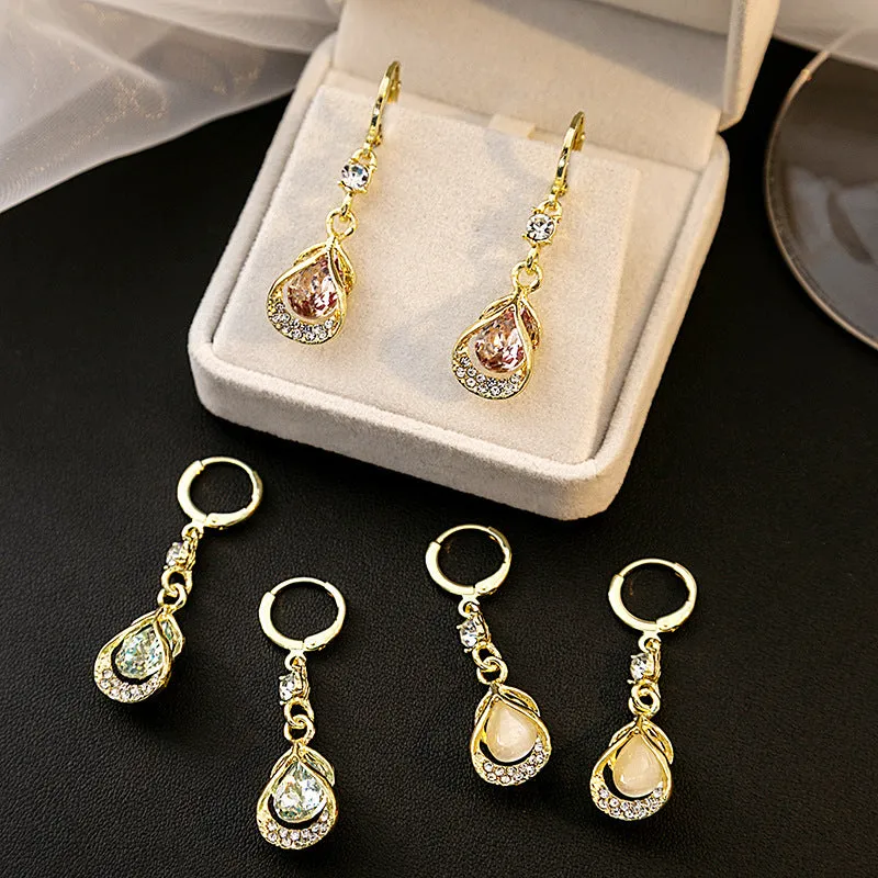 Wholesale Cat's Eye Stone Diamond Droplet Hollow Alloy Earrings