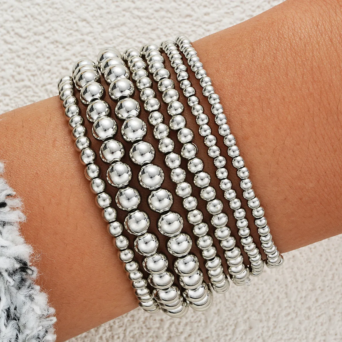 Wholesale Fashionable and simple elastic beaded bracelets 7 pieces