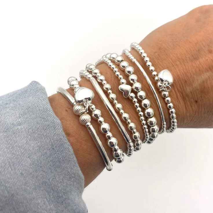 Wholesale Fashionable and simple elastic beaded bracelets 7 pieces