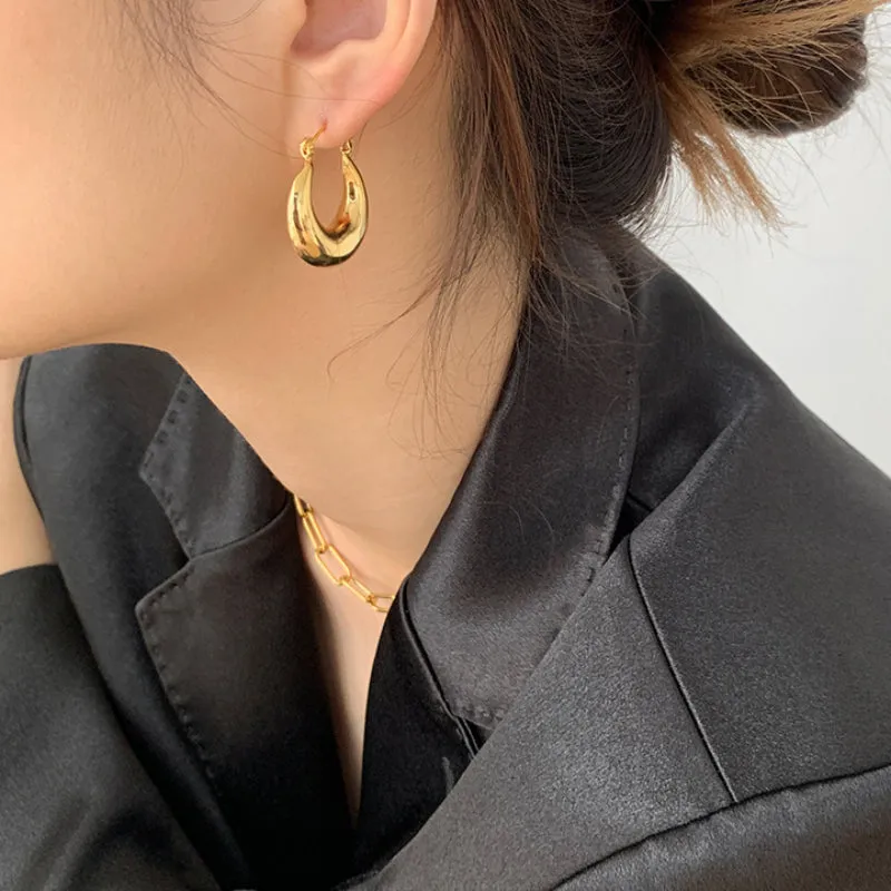 Wholesale Hollow Crescent Shaped Hollow Gold-plated Titanium Steel Earrings