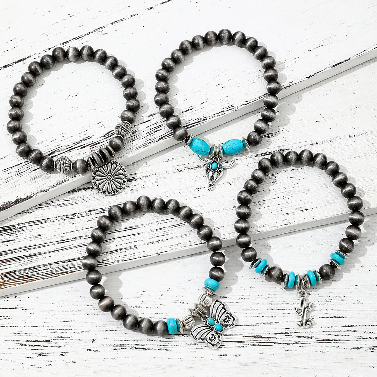 Wholesale Imitation pearl cactus butterfly bull head flower elastic bracelet