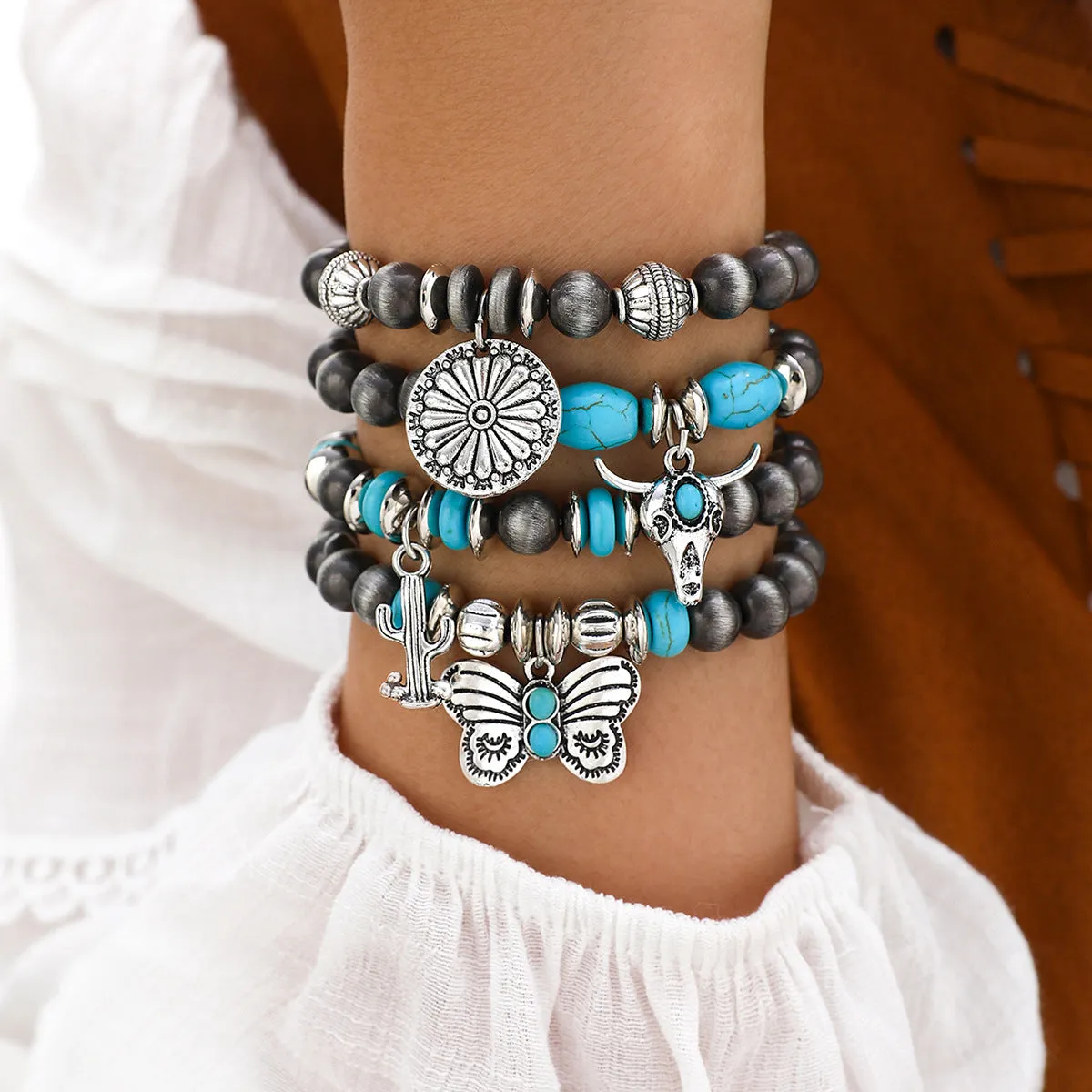 Wholesale Imitation pearl cactus butterfly bull head flower elastic bracelet