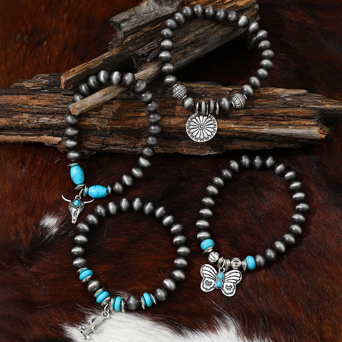 Wholesale Imitation pearl cactus butterfly bull head flower elastic bracelet