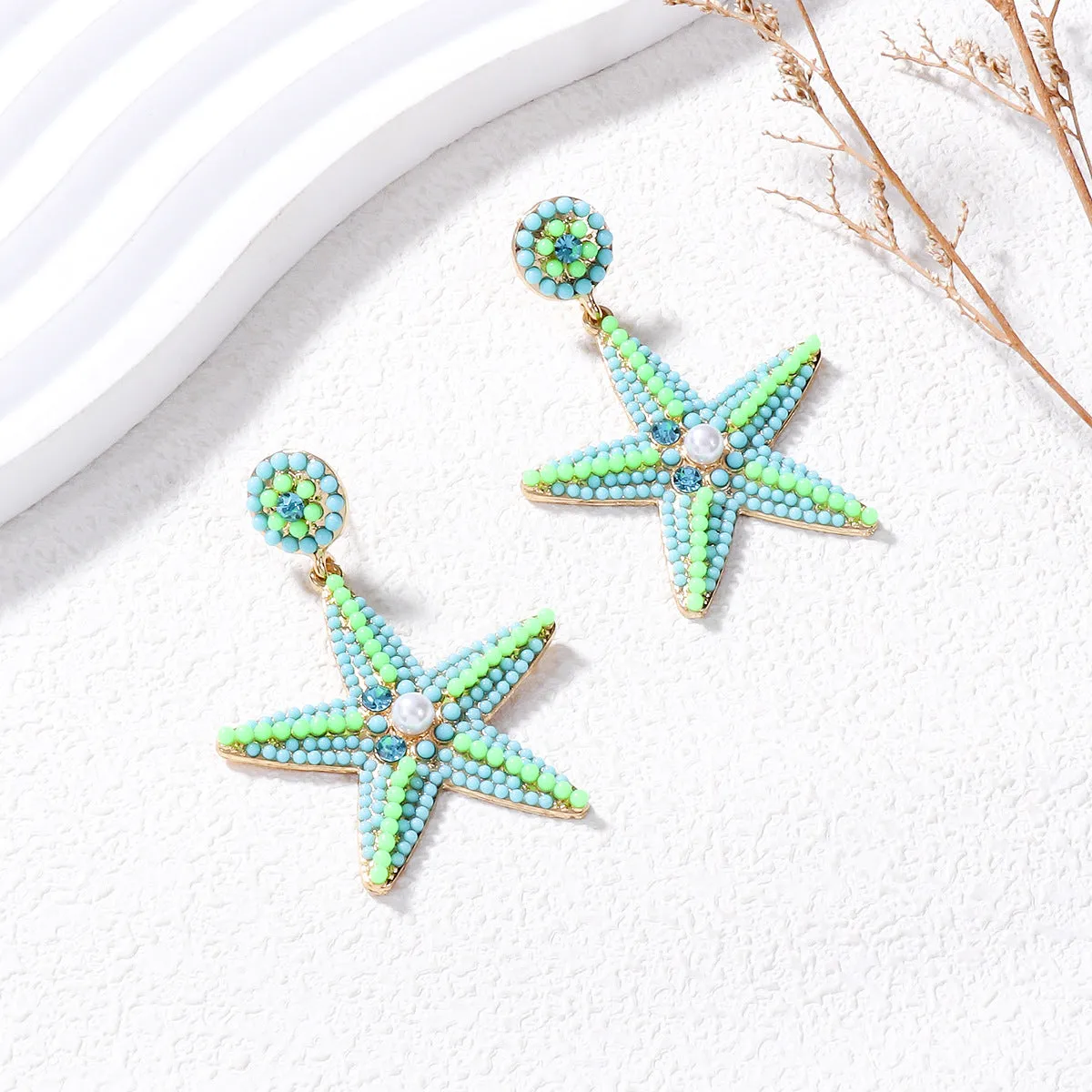 Wholesale of Butterfly Five Pointed Star Pearl Alloy Earrings