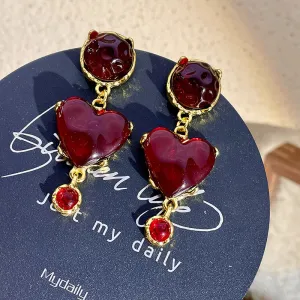 Wholesale of Glazed Red Heart Alloy Earrings