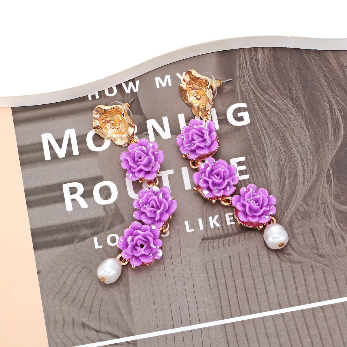 Wholesale of Long Purple Resin Flower Plastic Earrings