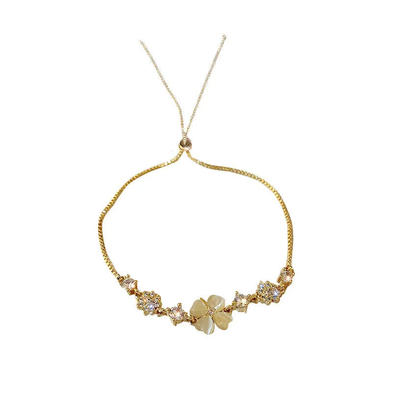Wholesale Real gold electroplated diamond cat's eye stone high-end temperament petal flower hand jewelry