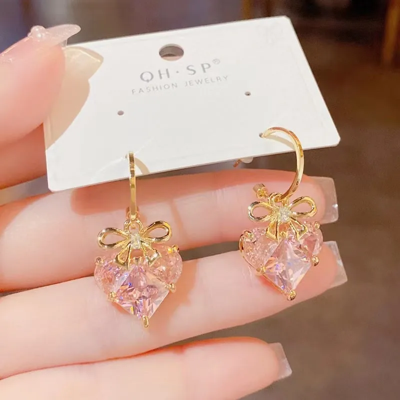 Wholesale Romantic heart-shaped peach pink earrings, fresh and sweet, simple and cool, super shiny earrings