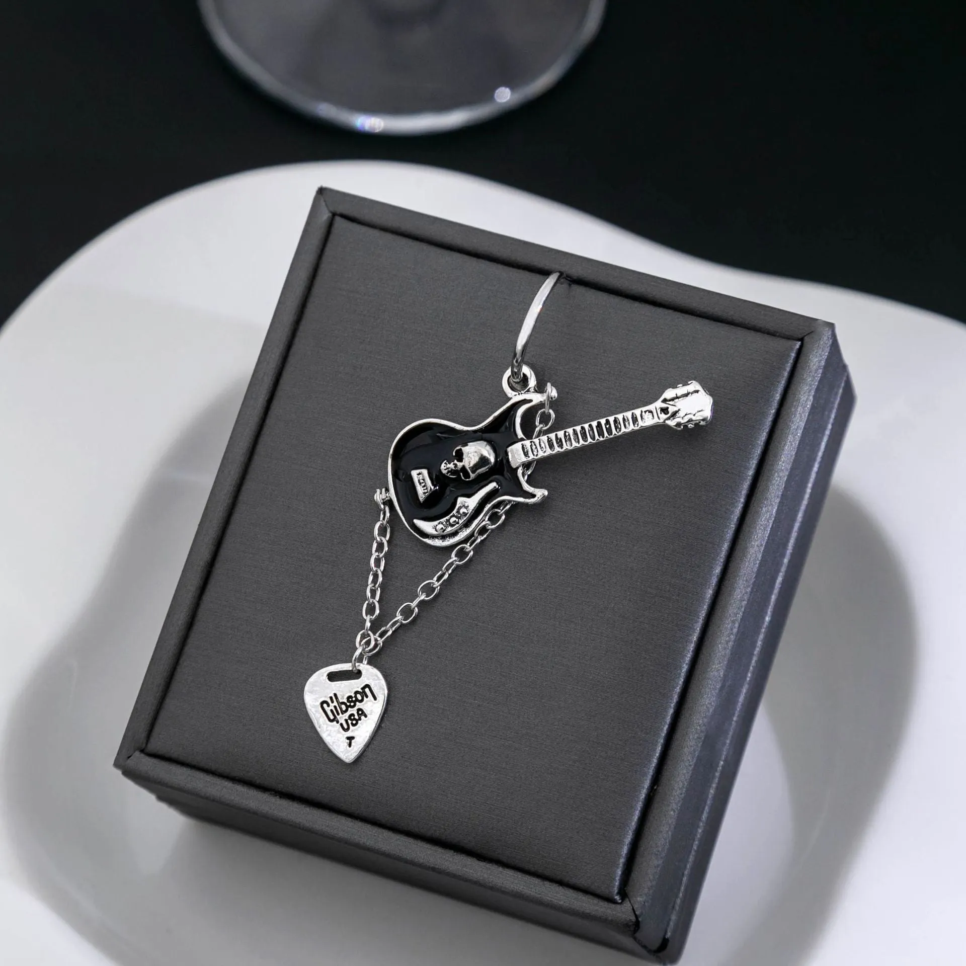 Wholesale Silver Needle Black Guitar Chain Alloy Earrings