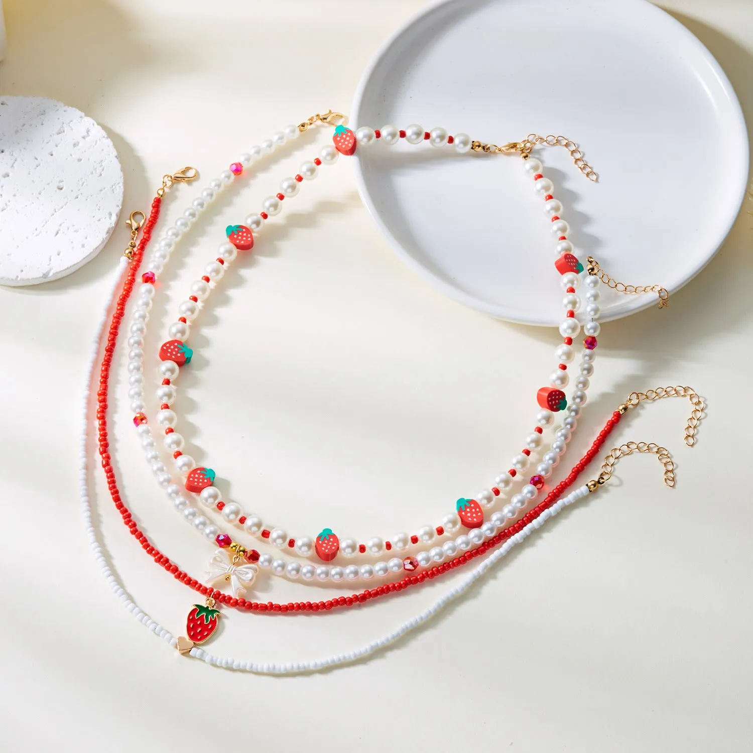 Wholesale Strawberry necklace simple summer small fresh soft ceramic rice pearl necklace female