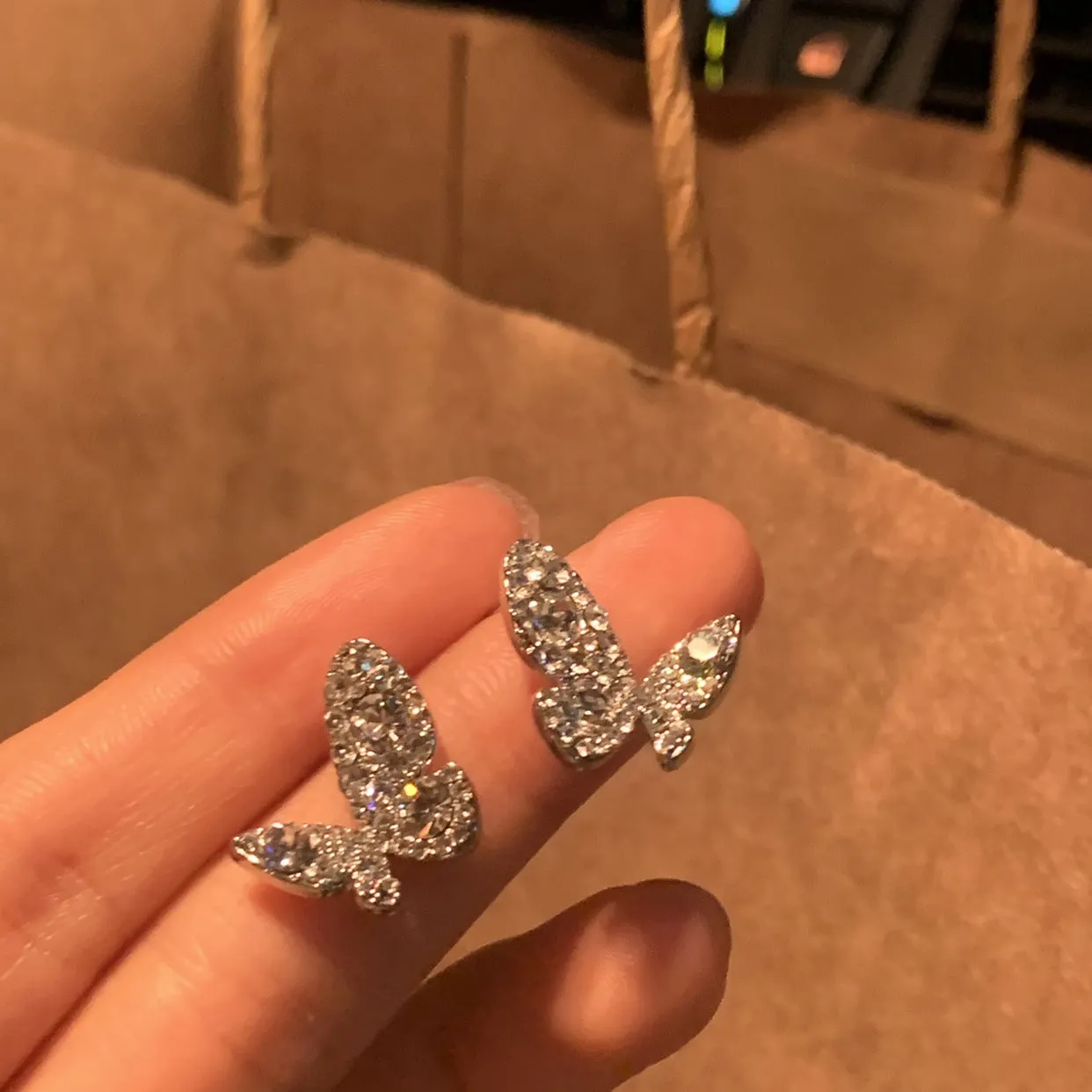 Wholesale Women's shiny butterfly clip earrings with full diamonds