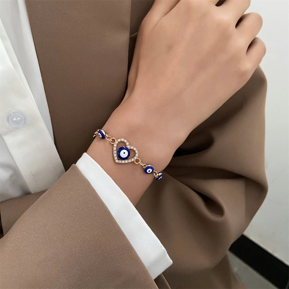 Wholesale Devil's Eye Hollow Diamond Heart Drip Oil Eye Alloy Bracelet