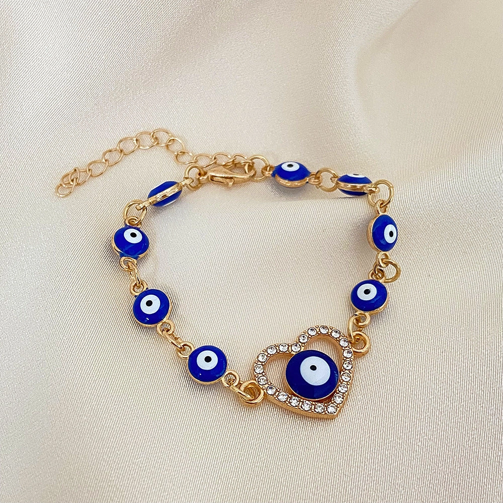 Wholesale Devil's Eye Hollow Diamond Heart Drip Oil Eye Alloy Bracelet