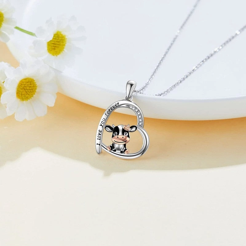 Wholesale of 10PCS Cute Cow Printed and Carved Heart Shaped Alloy Necklace