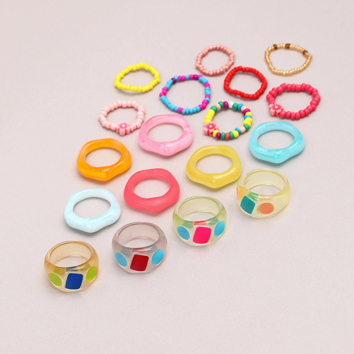 Wholesale of New Colored Rice Bead Flower Shaped Resin 18 Ring Sets