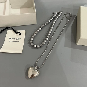 Wholesale Rice Bead Titanium Steel Necklace Hollow Heart Pendant Sweater Chain