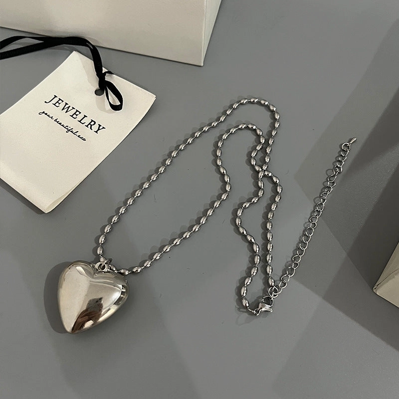 Wholesale Rice Bead Titanium Steel Necklace Hollow Heart Pendant Sweater Chain