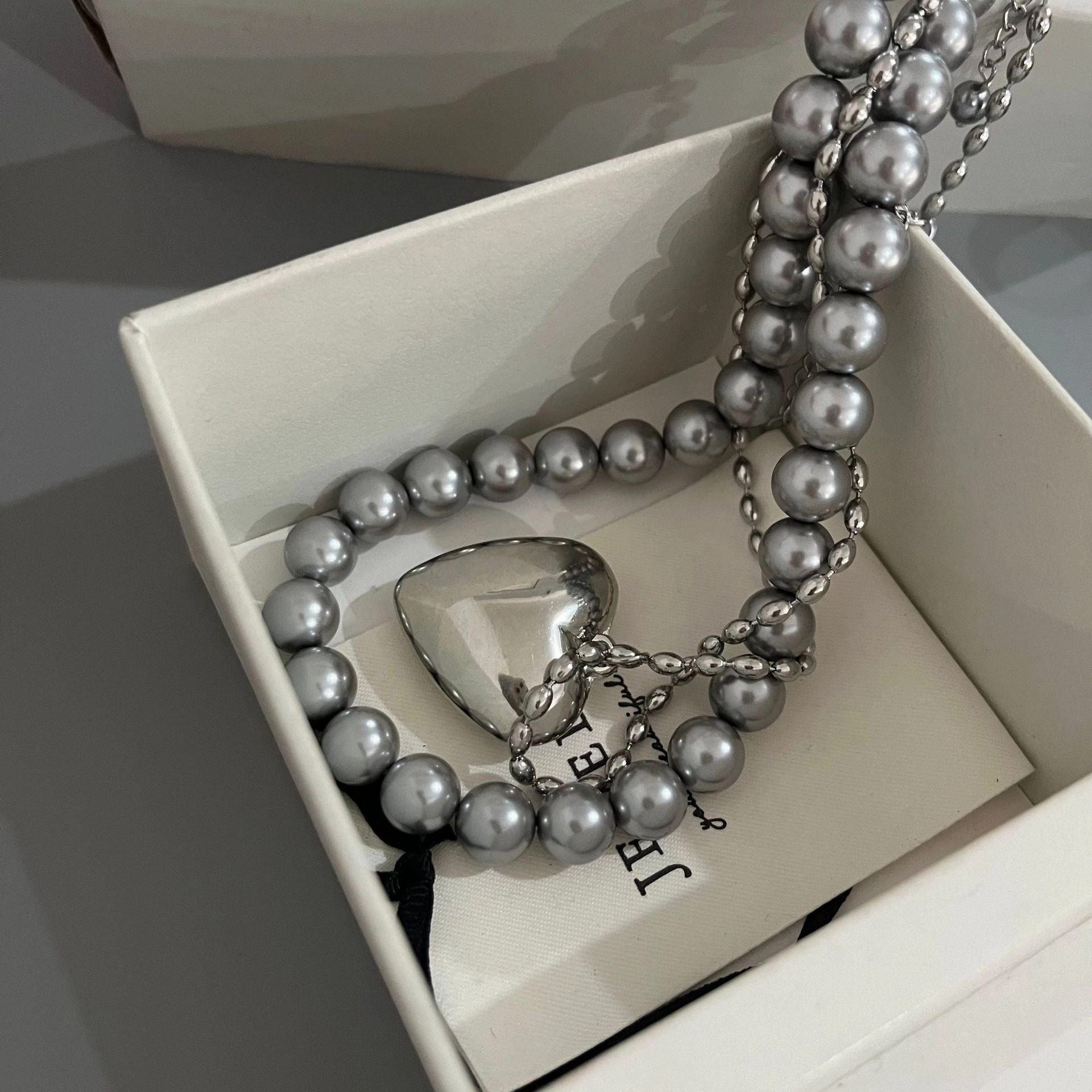 Wholesale Rice Bead Titanium Steel Necklace Hollow Heart Pendant Sweater Chain