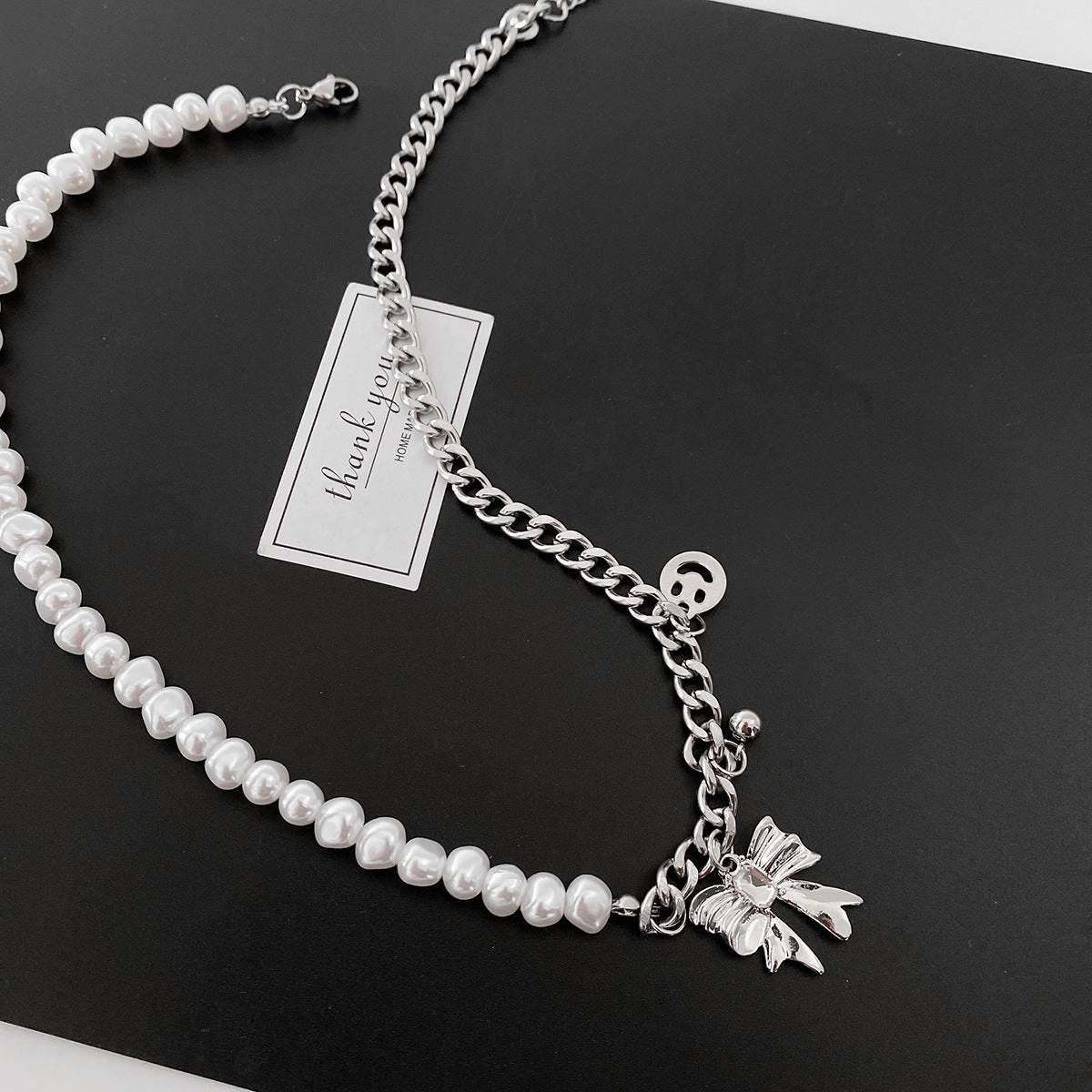 Wholesale Stitching Pearl Bow Smiley Necklaces
