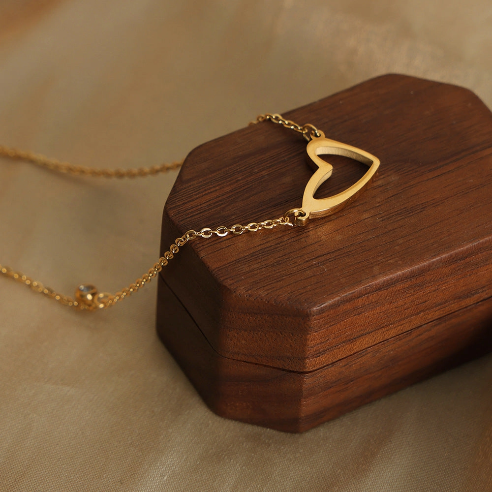 Wholesale Valentine's Day Titanium Steel 18k Gold Asymmetric Hollow Heart Pendant Necklace